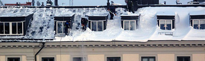 SNOW REMOVAL FROM PITCHED AND FLAT ROOFS